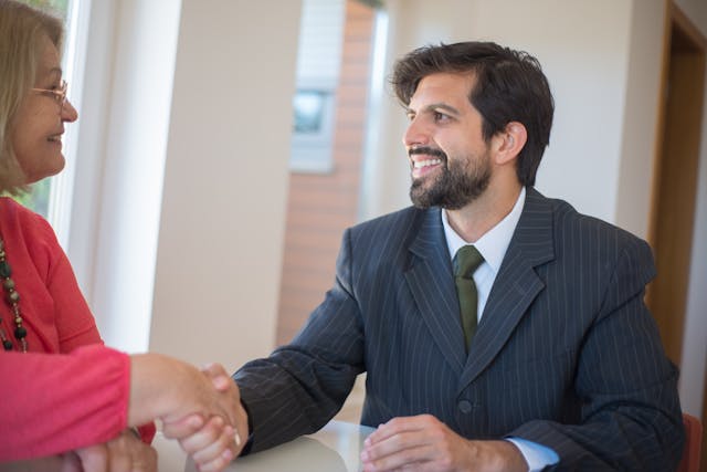 a%20property%20manager%20in%20a%20dark%20suit%20shaking%20hands%20with%20someone%20in%20pink a%20property%20manager%20in%20a%20dark%20suit%20shaking%20hands%20with%20someone%20in%20pink
